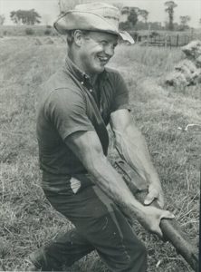 Bobby Hull ice hockey player working on the farm and smoking his cigar