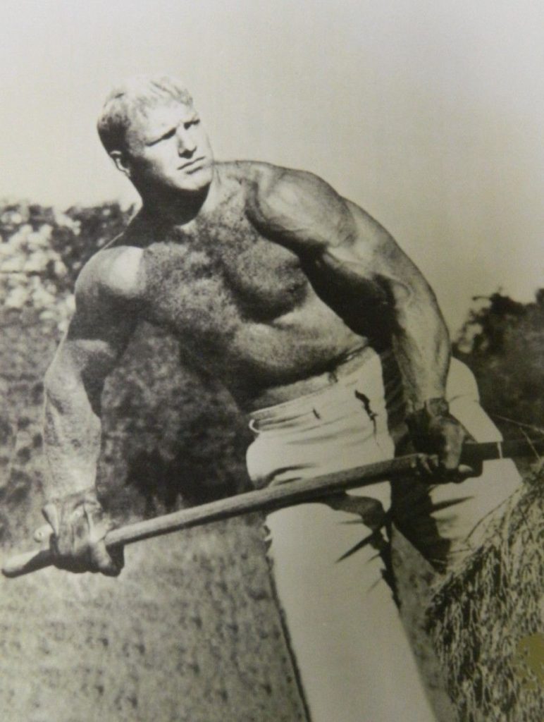 Bobby Hull ice hockey player working on the farm and smoking his cigar